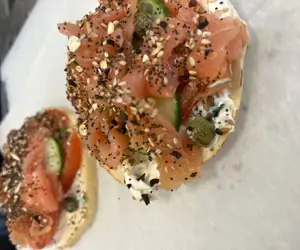 Salmon toasts with scallion cc tomato cucumber capers and ET bagel seeds 